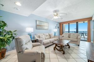 a living room with a couch and chairs and a table at Phoenix 2 Unit 2034 in Orange Beach