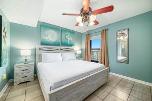 a bedroom with a bed and a ceiling fan at Phoenix 2 Unit 2034 in Orange Beach