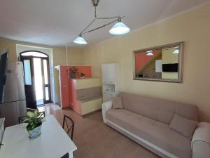 a living room with a couch and a table at A due passi dal portale in Ragusa
