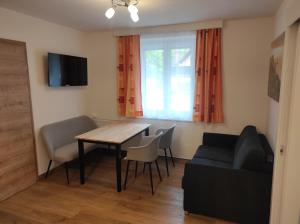 TV a/nebo společenská místnost v ubytování Putz Appartements