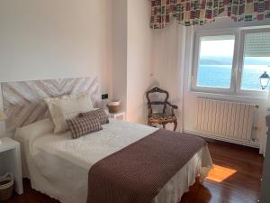 Posteľ alebo postele v izbe v ubytovaní Casa Castillo Finisterre
