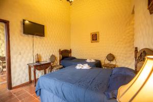 Voodi või voodid majutusasutuse Hotel Caxa Real toas