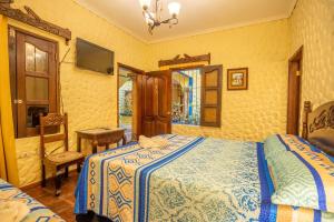 Voodi või voodid majutusasutuse Hotel Caxa Real toas