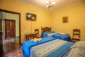 Voodi või voodid majutusasutuse Hotel Caxa Real toas