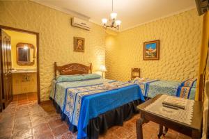 Voodi või voodid majutusasutuse Hotel Caxa Real toas