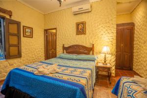Voodi või voodid majutusasutuse Hotel Caxa Real toas