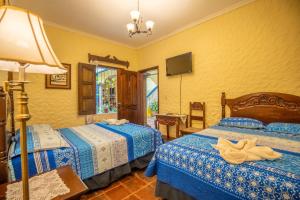 Voodi või voodid majutusasutuse Hotel Caxa Real toas
