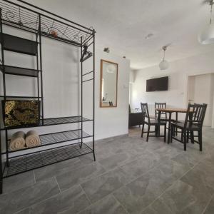 a room with a bunk bed and a table at Vila Natasa Apartment 5 near Plitvice in Vrhovine