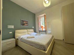 Ένα ή περισσότερα κρεβάτια σε δωμάτιο στο La Casa del Pinguino - In the Center with AC