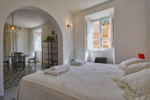 Ένα ή περισσότερα κρεβάτια σε δωμάτιο στο Palazzetto d'epoca +35 φωτογραφίες