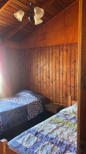 Postel nebo postele na pokoji v ubytování Cabaña nocican + 5 fotografií