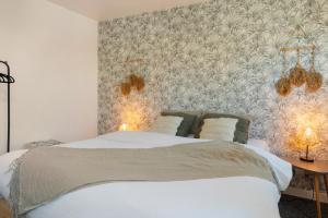 Postel nebo postele na pokoji v ubytování Charmante Maison à Rouen