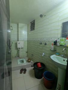 a small bathroom with a sink and a toilet at Revert in Dhaka