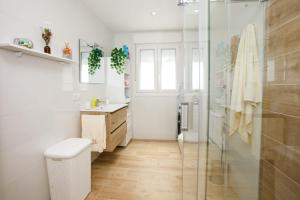 a bathroom with a shower and a sink at Casa Chan in Budiño +12 photos