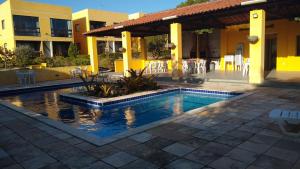 a swimming pool in front of a building at flat 013 - Serra Negra - Bezerros - PE in Bezerros +51 photos
