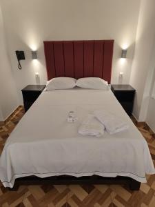 Postel nebo postele na pokoji v ubytování Hostal Prestigio