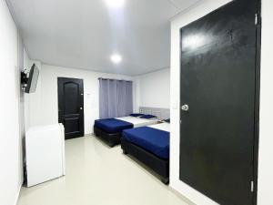 Postel nebo postele na pokoji v ubytování Bless Hotel