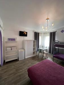 Postel nebo postele na pokoji v ubytování Hotel Clair Logis