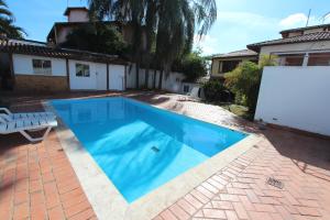 A piscina localizada em Wafeh Pampulha Suítes ou nos arredores