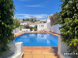 a swimming pool in the backyard of a house at VH CostaBlanca - MORAVIT in Moraira
