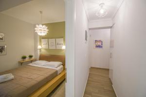Postel nebo postele na pokoji v ubytování Bianca Suites