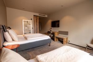 Postel nebo postele na pokoji v ubytování Hotel Melfarhus