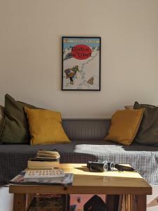 a living room with a couch and a table at Hikers' Corner - Planinarka in Kolašin