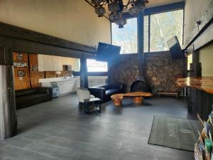 a living room with a couch and a fireplace at Studio 9 Big Bear Lake in Big Bear Lake