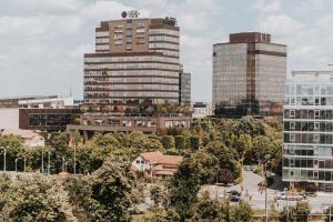 a city skyline with tall buildings at Apartament Nord One in Timişoara