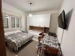 A bed or beds in a room at Hotel Fioralba