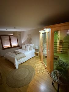 a bedroom with a white bed and a window at Le Nid Zen Obernois - 4 guests in Obernai +10 photos