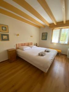 a bedroom with a large bed in a room at Villa Dreamland à Seignosse océan in Seignosse +20 photos