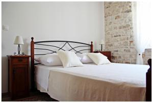 Postel nebo postele na pokoji v ubytování Guest House Tragurion