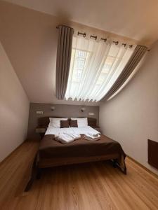 Postel nebo postele na pokoji v ubytování Hotel&SPA Pysanka, Готель Писанка, 3 сауни та джакузі - індивідуальний відпочинок у СПА