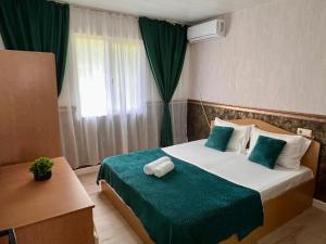 Postel nebo postele na pokoji v ubytování Casa Buşcu