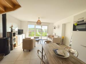 a kitchen and living room with a table and chairs at GC - Idem in Wissant +41 photos