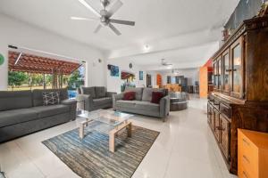 a living room with couches and a coffee table at Tranquilo - Private Pool Near Beach Sleeps 16 in Ixtapa +33 photos