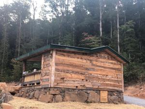 a small wooden building on the side of a road at Tree top View 15 in Rising Fawn