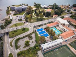 an aerial view of a city with a road and a pool at Al Centro in Verbania
