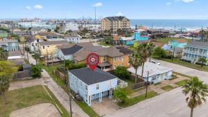 an aerial view of a residential neighborhood with a stop sign at Beach lovers dream come true walking distance to the sandy shores in Galveston