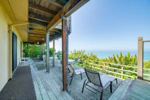 a balcony with chairs and a view of the ocean at Oceanfront Irish Beach Home Private Beach Access! in Manchester