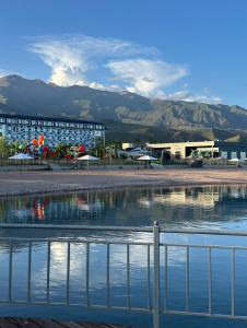 a view of a hotel with mountains in the background at Issyk Kul in Korumdy