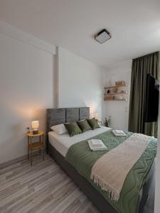 a bedroom with a large bed and a television at Sal y Sol in Bar +16 photos