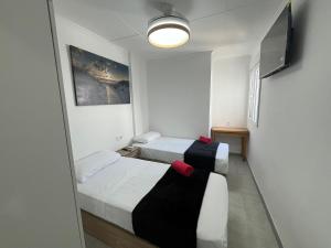 Postel nebo postele na pokoji v ubytování La Torre de Babel