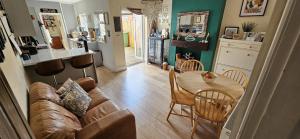 a living room with a couch and a table at Lovely house in Redditch in Headless Cross
