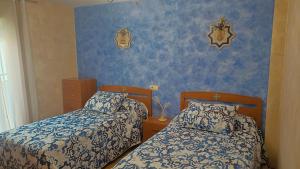 Ένα ή περισσότερα κρεβάτια σε δωμάτιο στο Casa el Alfar mudéjar