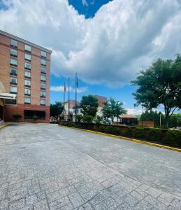 an empty parking lot in front of a building at Lynchburg Grand Hotel in Lynchburg