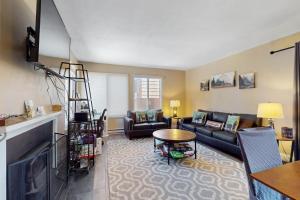a living room with a couch and a table at 11529 Snowpeak Way #619 in Truckee