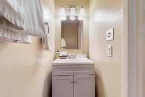 a bathroom with a sink and a mirror at 11529 Snowpeak Way #619 in Truckee +8 photos