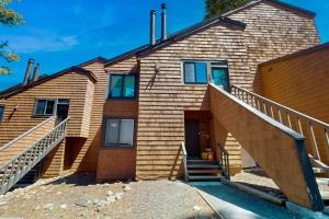 a house with stairs in front of it at 11529 Snowpeak Way #619 in Truckee